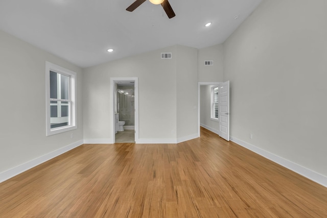 spare room featuring visible vents, light wood-type flooring, and ceiling fan