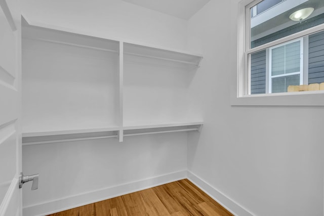 spacious closet with wood finished floors