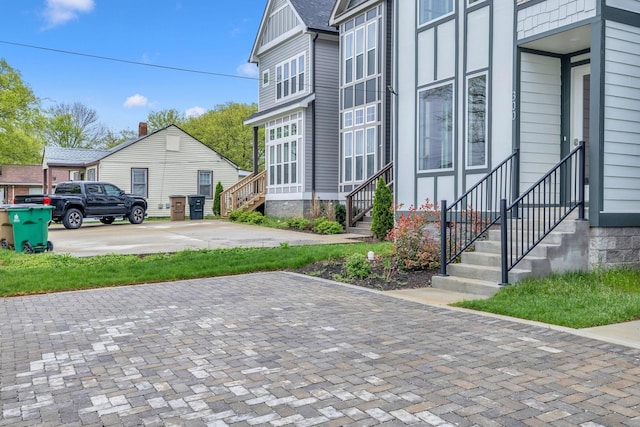 view of side of property with entry steps