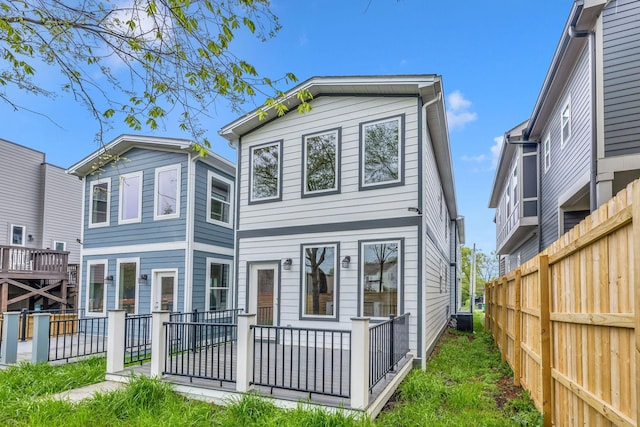 view of front of home with fence