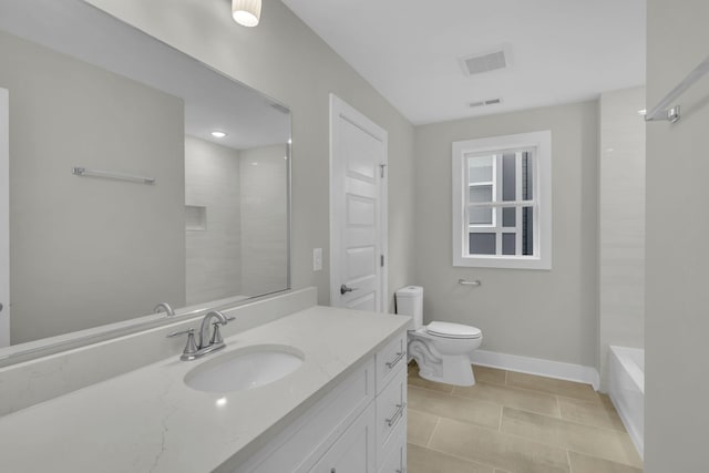 bathroom with vanity, visible vents, baseboards, tile patterned flooring, and toilet