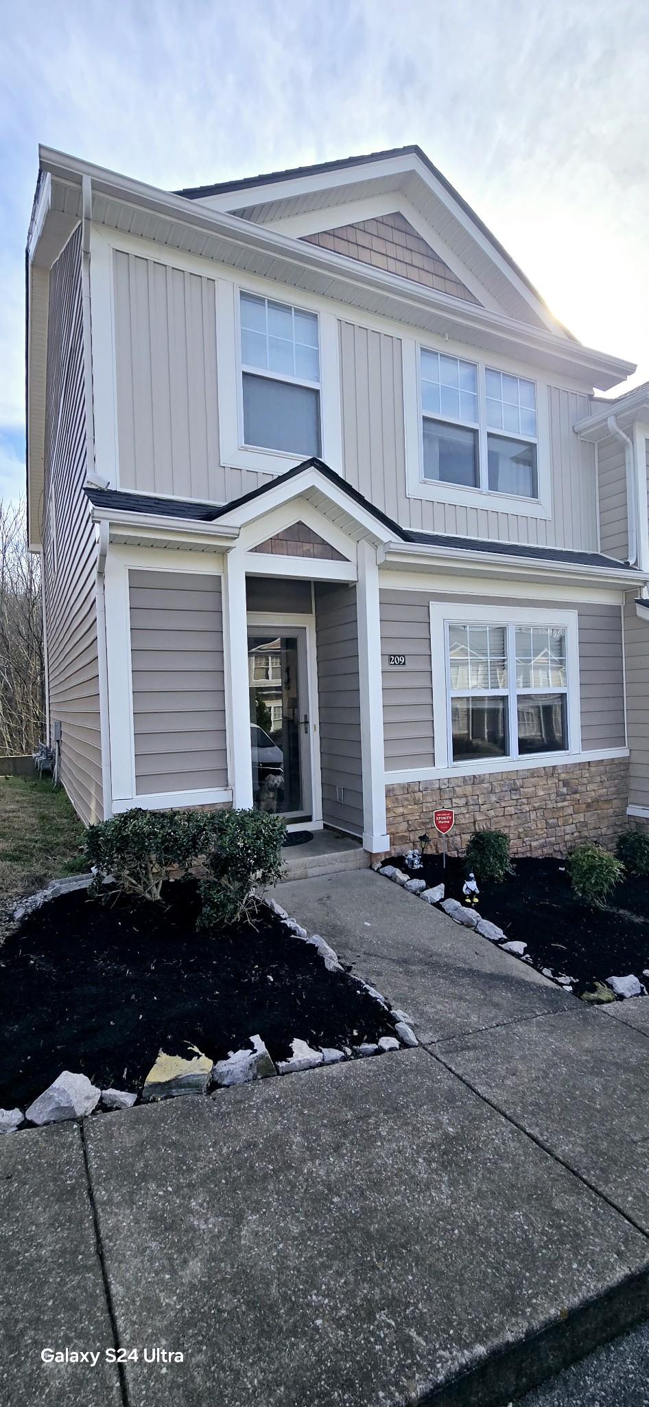 view of front of house with stone siding