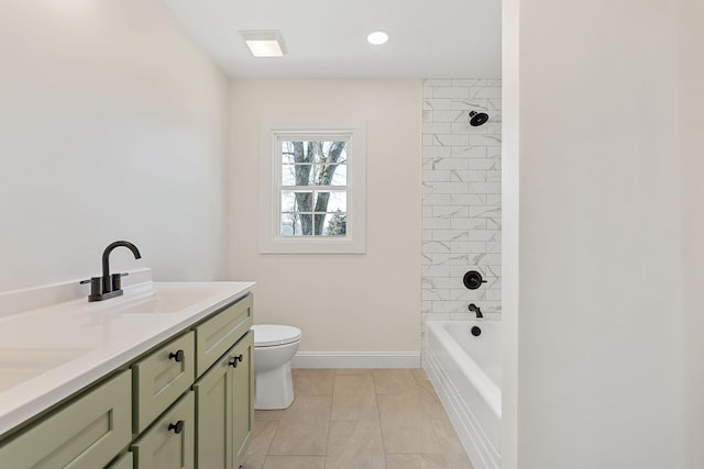 full bathroom featuring baseboards, toilet, shower / bath combination, double vanity, and a sink