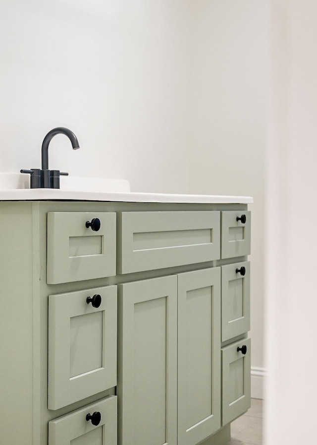 room details featuring baseboards and a sink