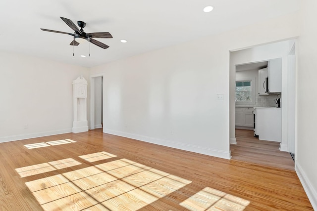 unfurnished room with recessed lighting, baseboards, light wood-style floors, and a ceiling fan