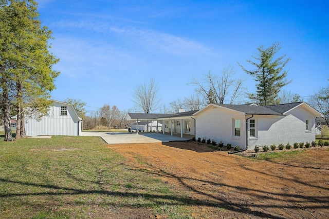 exterior space with a yard and a carport