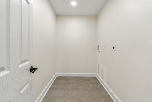 clothes washing area with laundry area, hookup for an electric dryer, baseboards, and washer hookup