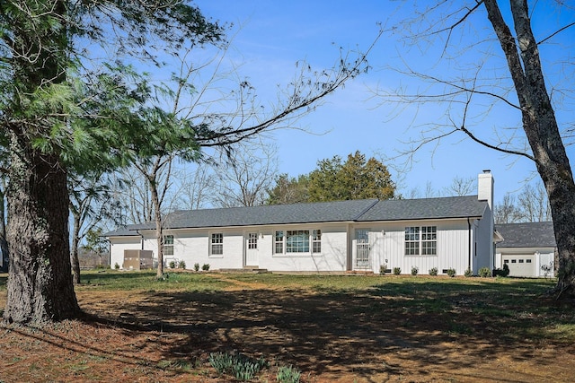 view of front of property with board and batten siding and a chimney