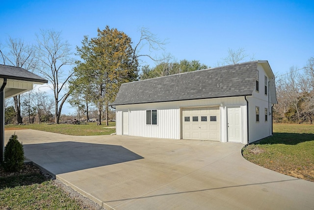 garage featuring concrete driveway