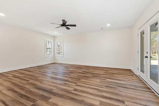 unfurnished room with recessed lighting, baseboards, ceiling fan, and wood finished floors