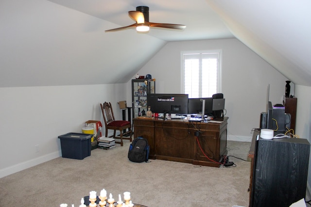 carpeted office featuring baseboards, lofted ceiling, and ceiling fan