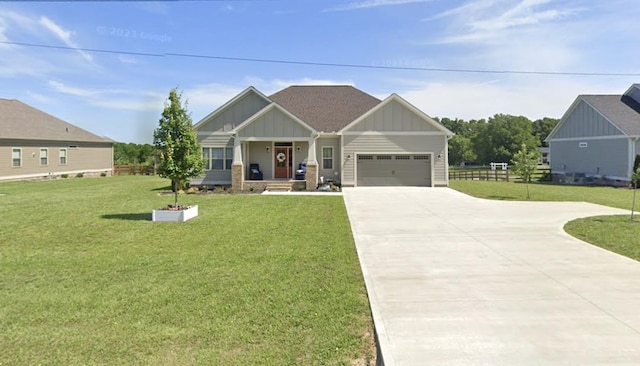 craftsman house with an attached garage, board and batten siding, concrete driveway, and a front yard