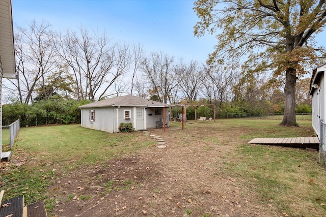 view of yard featuring an outbuilding and a fenced backyard