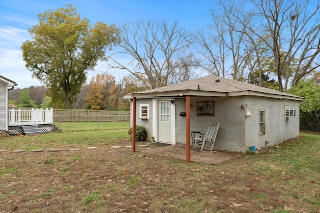 view of outbuilding featuring fence