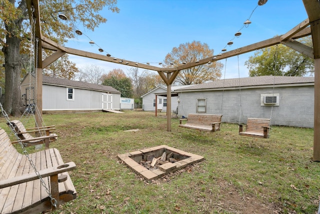 view of yard featuring an outdoor fire pit