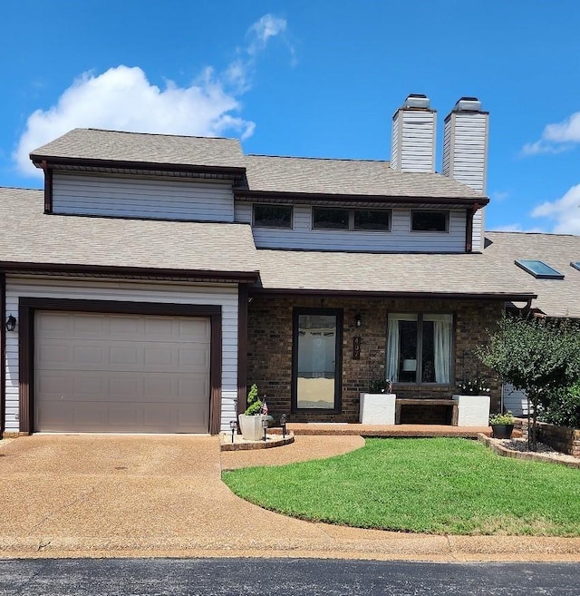 view of front of home with a front yard, covered porch, a chimney, and a shingled roof