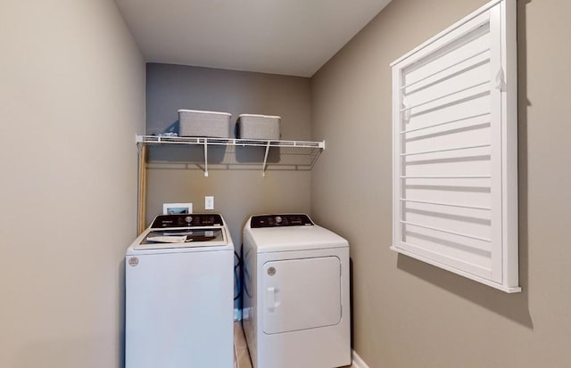 washroom featuring laundry area and washing machine and dryer