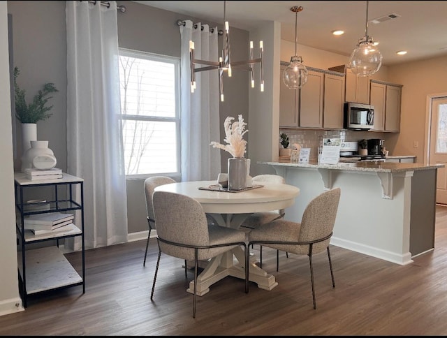 dining room with visible vents, baseboards, recessed lighting, dark wood-style flooring, and a chandelier