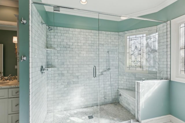 bathroom with vanity, crown molding, and a stall shower