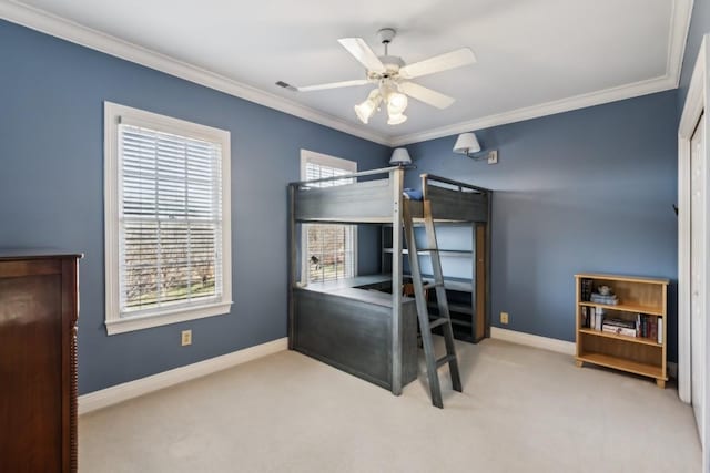 carpeted bedroom with visible vents, crown molding, and baseboards