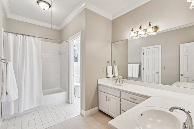 bathroom featuring a sink, double vanity, and crown molding