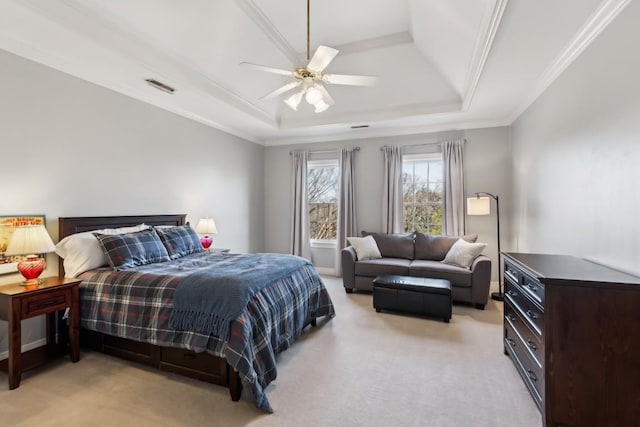 bedroom with visible vents, light colored carpet, crown molding, and a raised ceiling