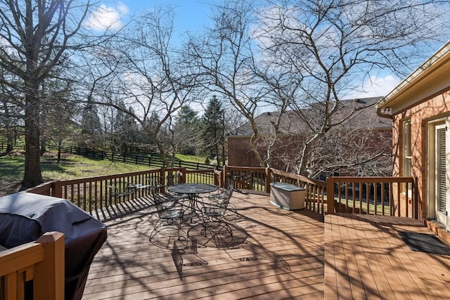 deck featuring area for grilling and outdoor dining space