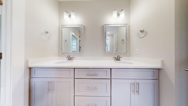 bathroom with double vanity and a sink