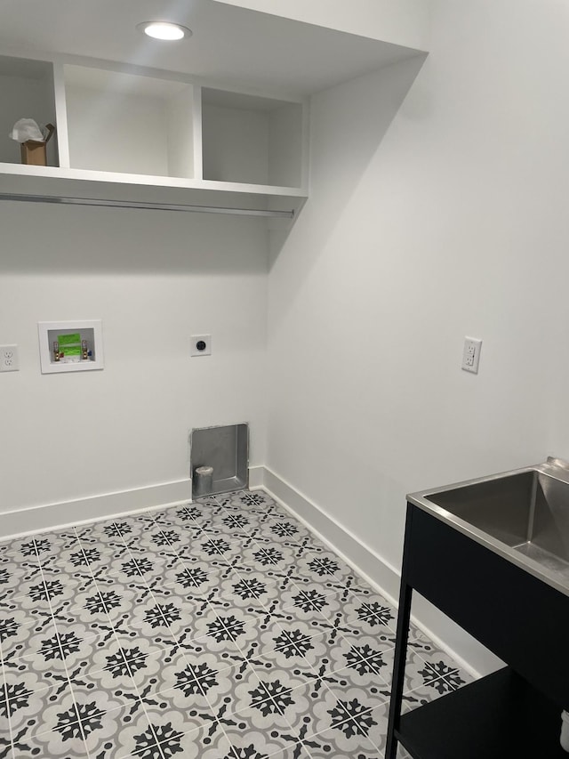 clothes washing area with electric dryer hookup, tile patterned floors, baseboards, hookup for a washing machine, and laundry area