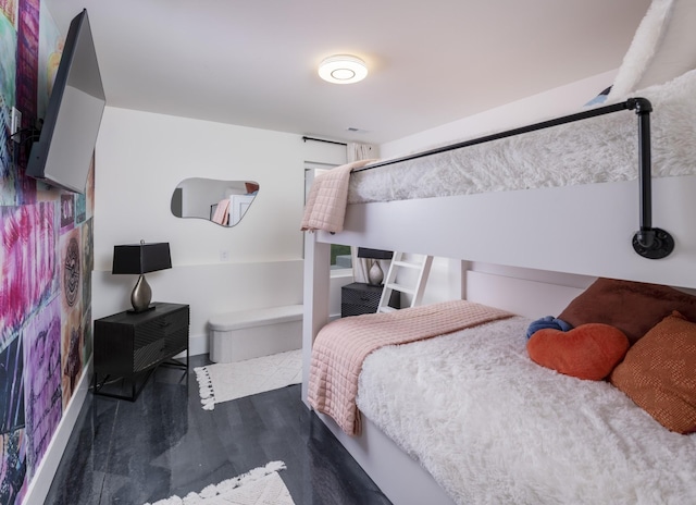 bedroom featuring wood finished floors