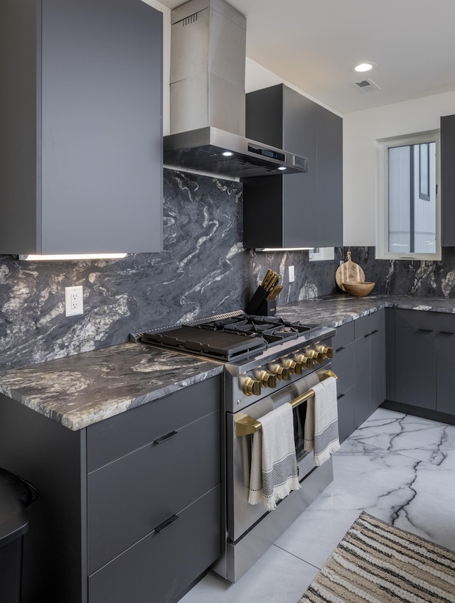 kitchen with visible vents, marble finish floor, stainless steel gas range, wall chimney exhaust hood, and modern cabinets