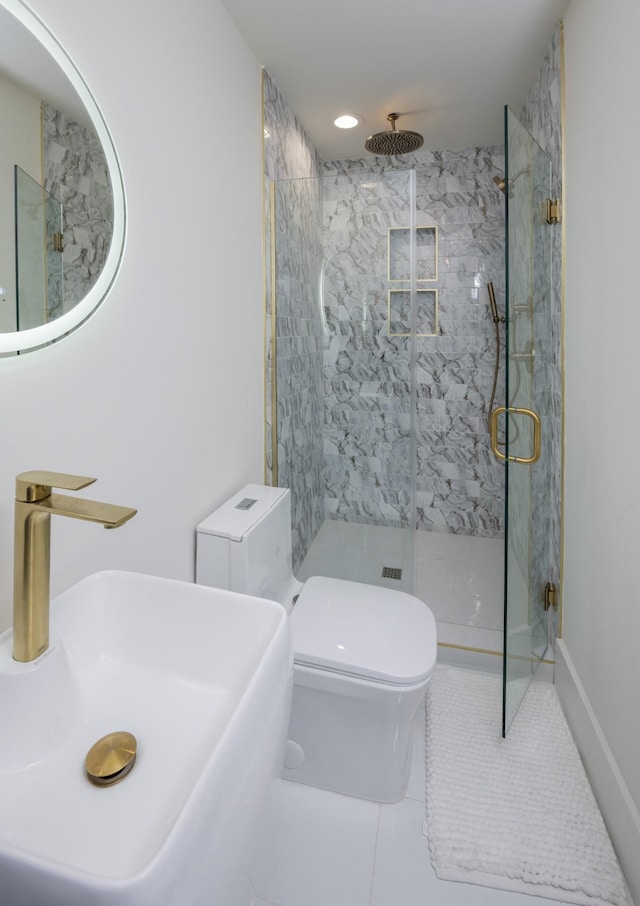 full bath featuring a sink, toilet, a stall shower, and tile patterned flooring