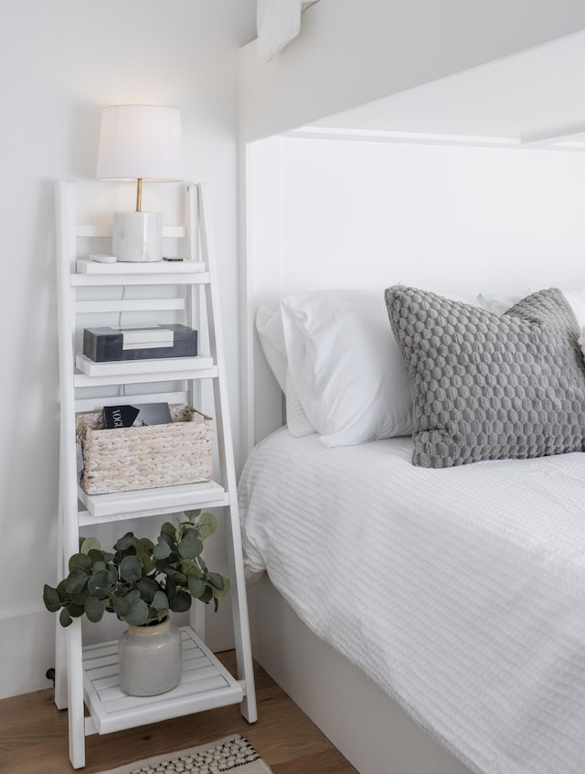 bedroom with wood finished floors