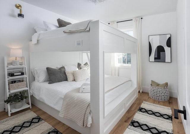 bedroom featuring wood finished floors