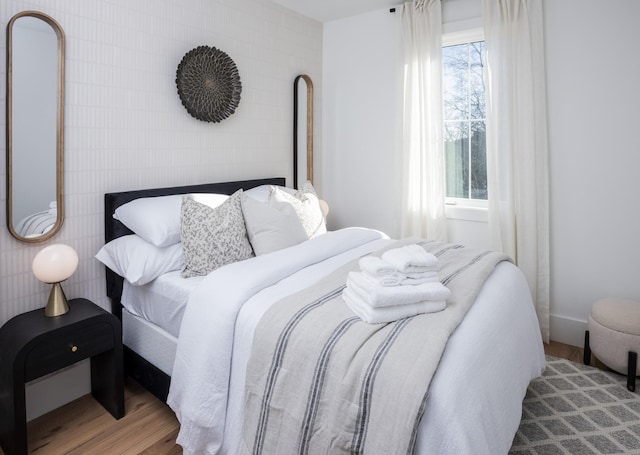 bedroom featuring wood finished floors