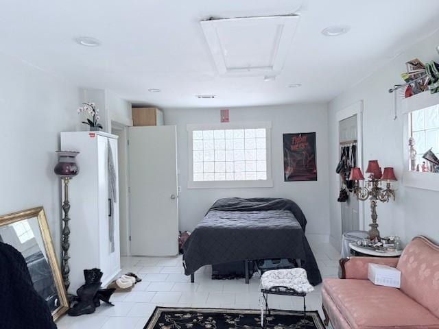 bedroom featuring attic access