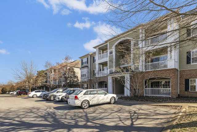 view of property featuring uncovered parking