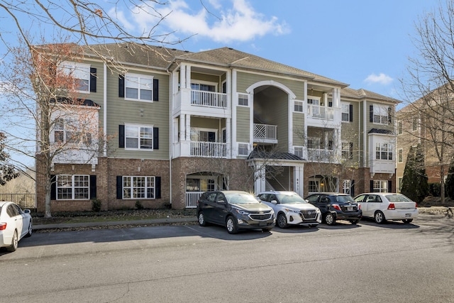 view of property with uncovered parking