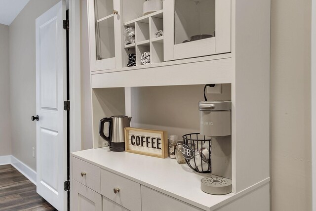 room details with baseboards and wood finished floors