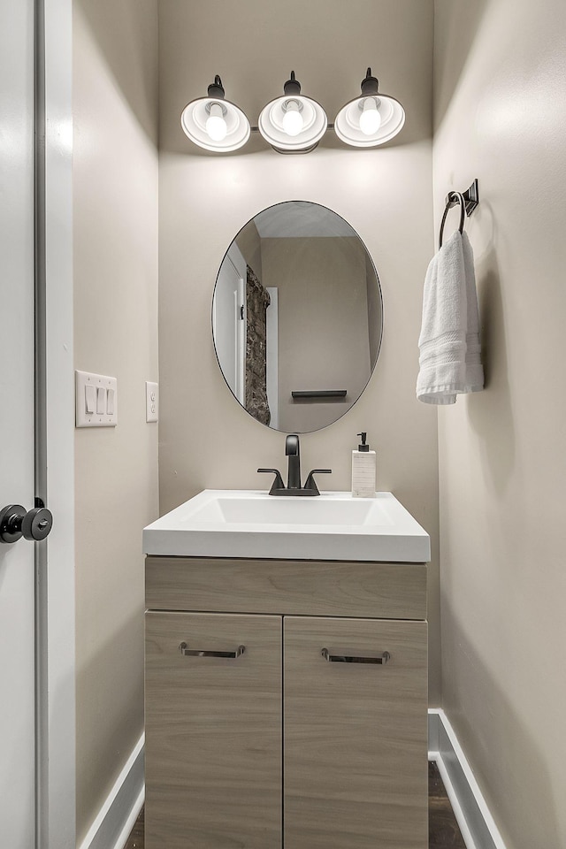 bathroom featuring baseboards and vanity