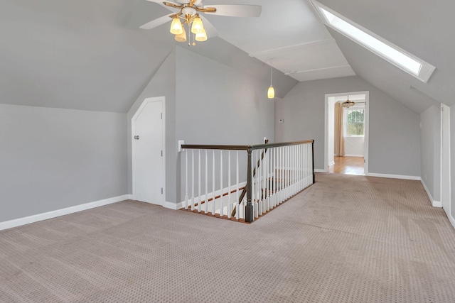 bonus room featuring baseboards, ceiling fan, and carpet floors