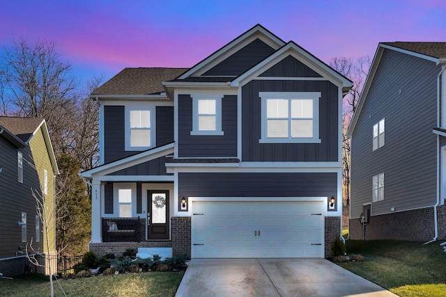 craftsman inspired home featuring brick siding, board and batten siding, concrete driveway, and a garage