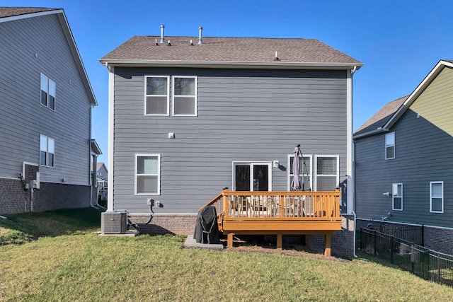 back of property featuring a lawn, fence, cooling unit, a shingled roof, and a wooden deck