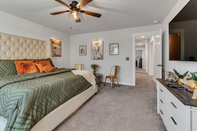 bedroom featuring ceiling fan, baseboards, and light carpet