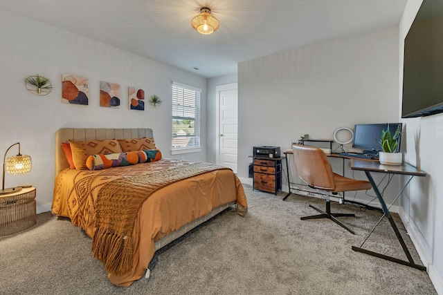 bedroom featuring baseboards and carpet