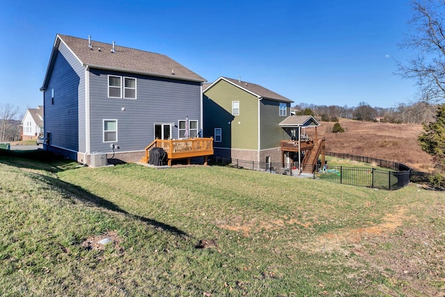 back of house with a wooden deck, a yard, central AC unit, and a fenced backyard