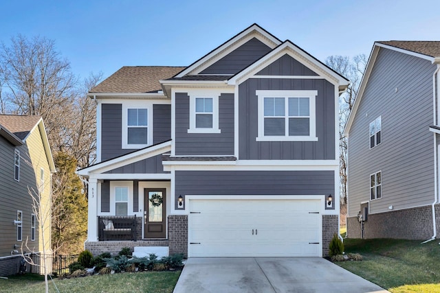 craftsman-style house featuring a garage, brick siding, board and batten siding, and driveway