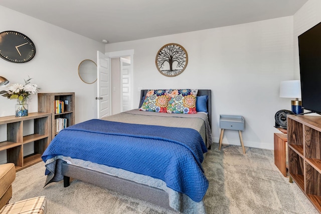 carpeted bedroom with baseboards