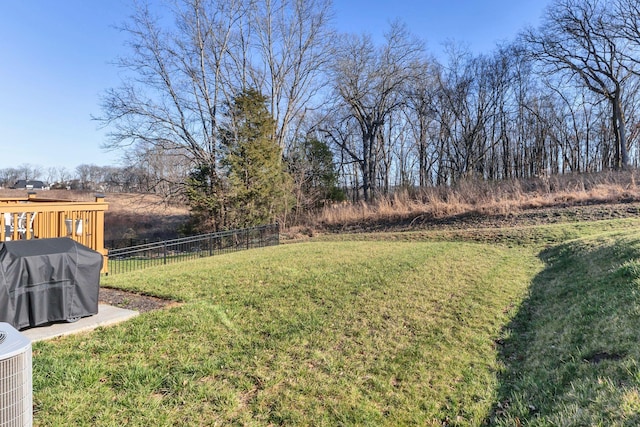 view of yard with cooling unit and fence