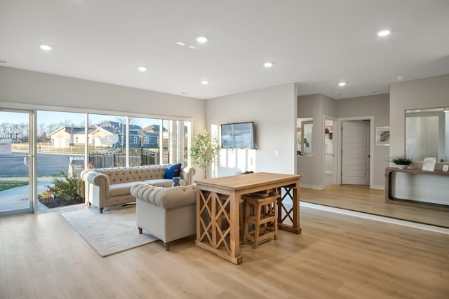 living room with recessed lighting and light wood-type flooring